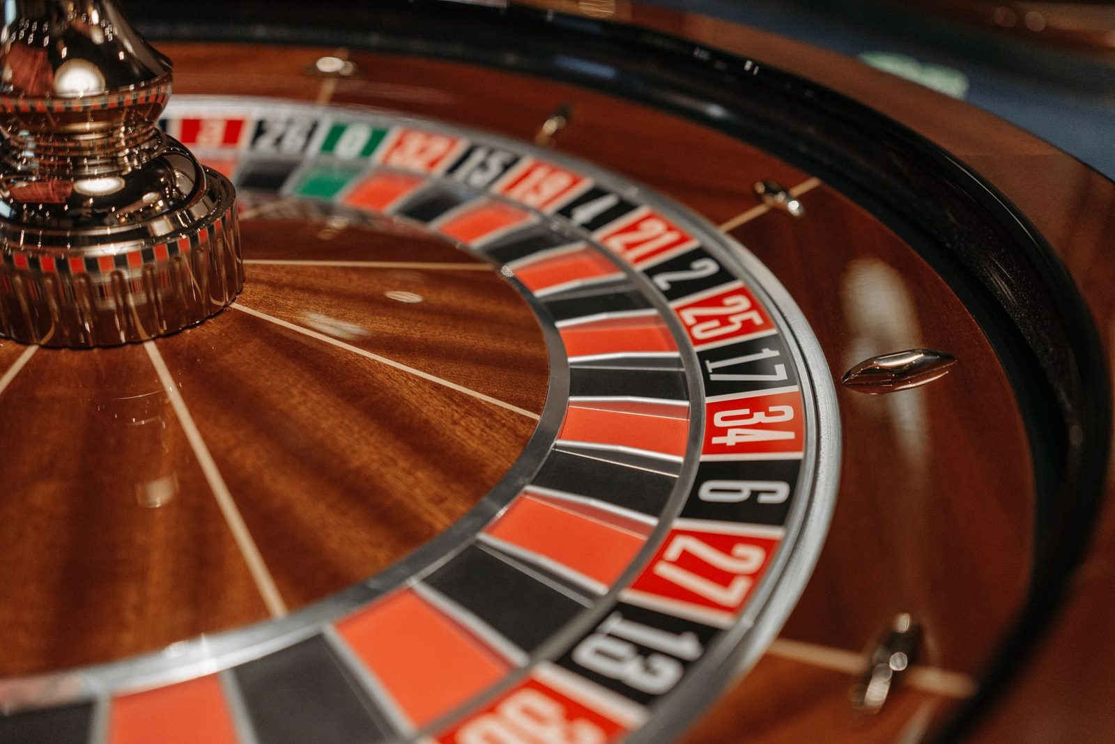 Close-up of an elegant roulette wheel showcasing numbers and colors, ideal for casino themes.
