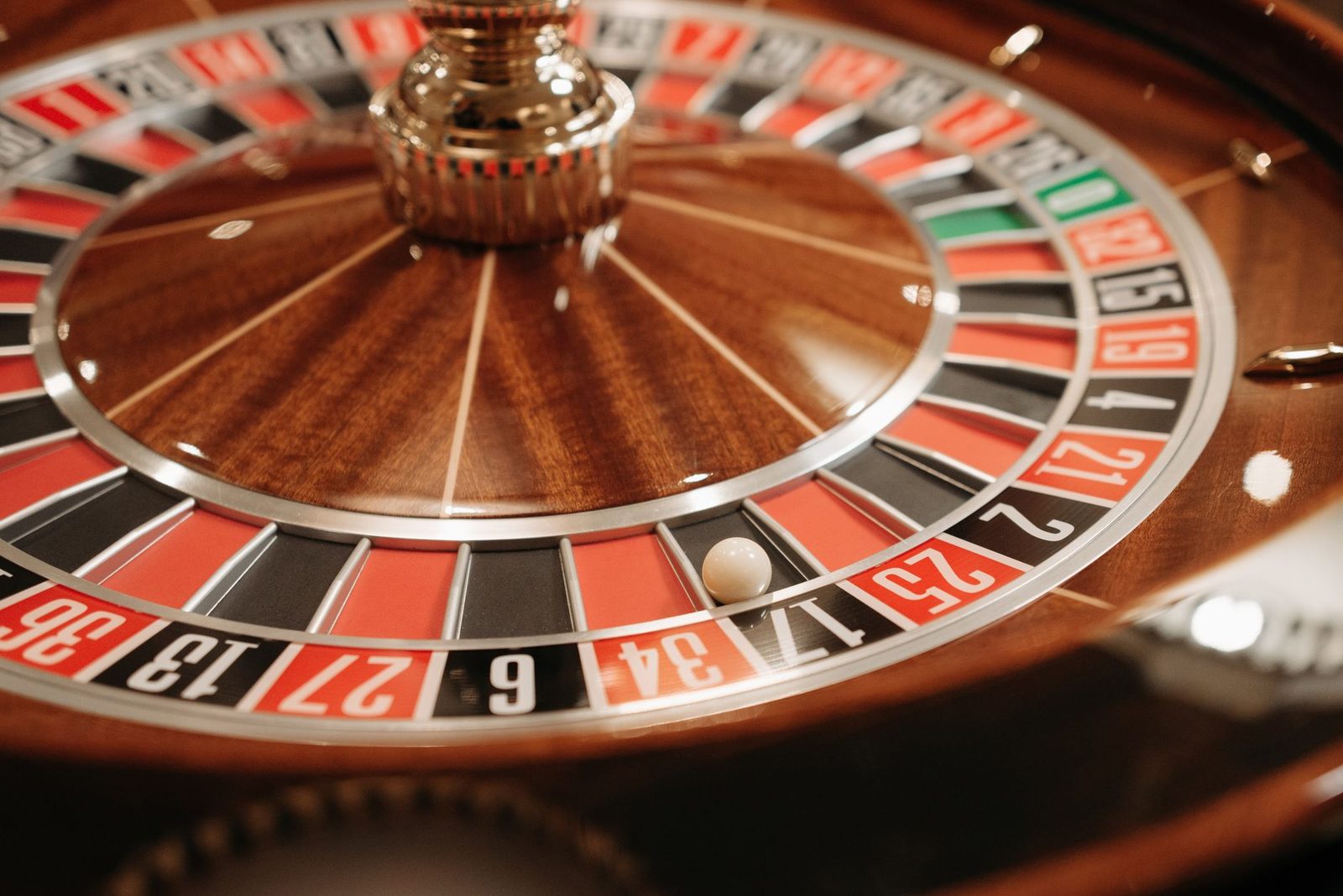 A detailed close-up of a spinning roulette wheel with the ball in play, capturing the essence of casino excitement and g