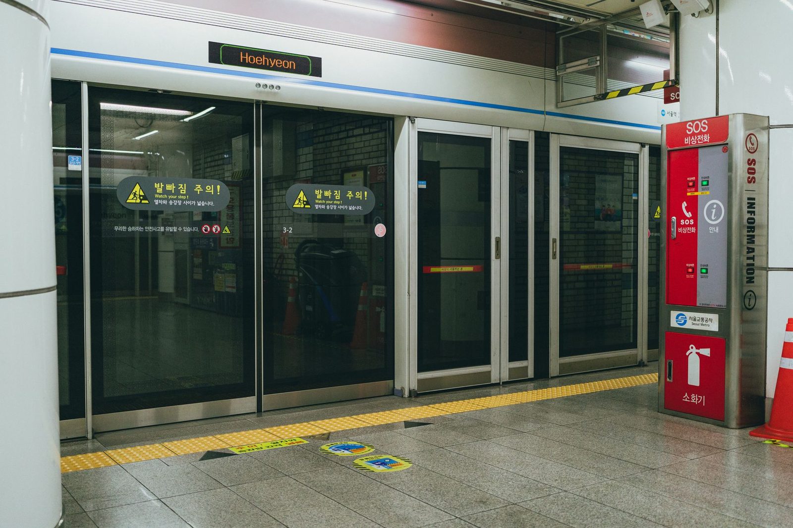Entrance to the Seoul subway platform at Hoehyeon Station, highlighting modern Korean public transport design.