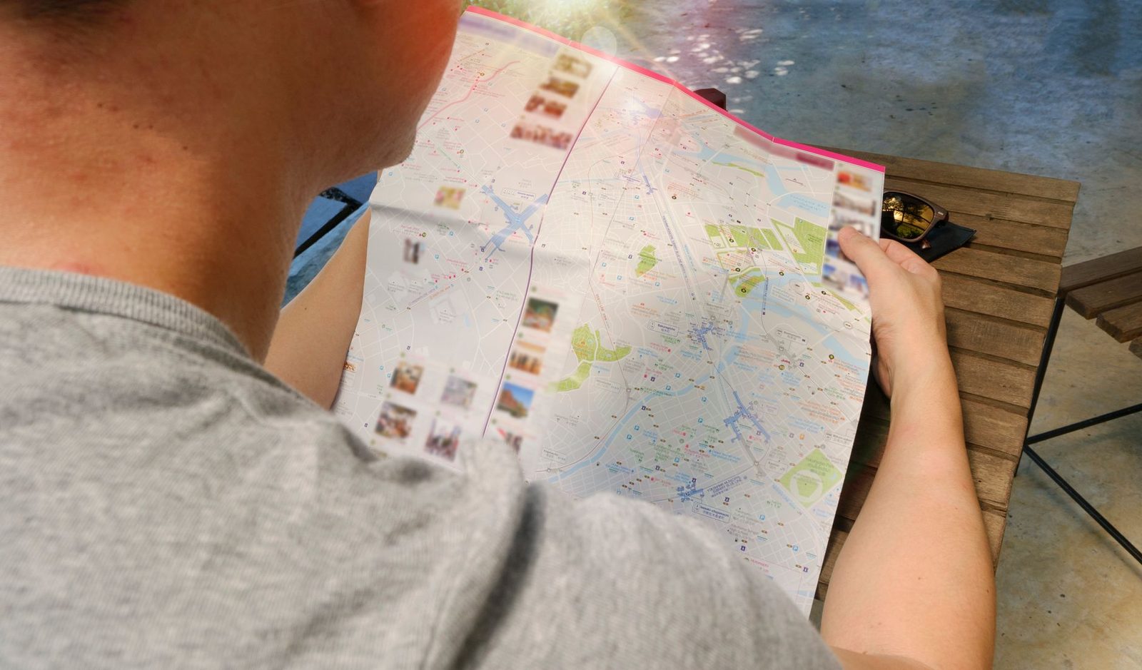 Traveler studying a map for directions, symbolizing exploration and adventure.